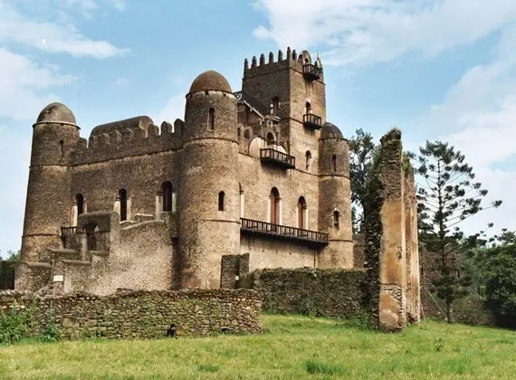 A castle like building with many windows and walls.