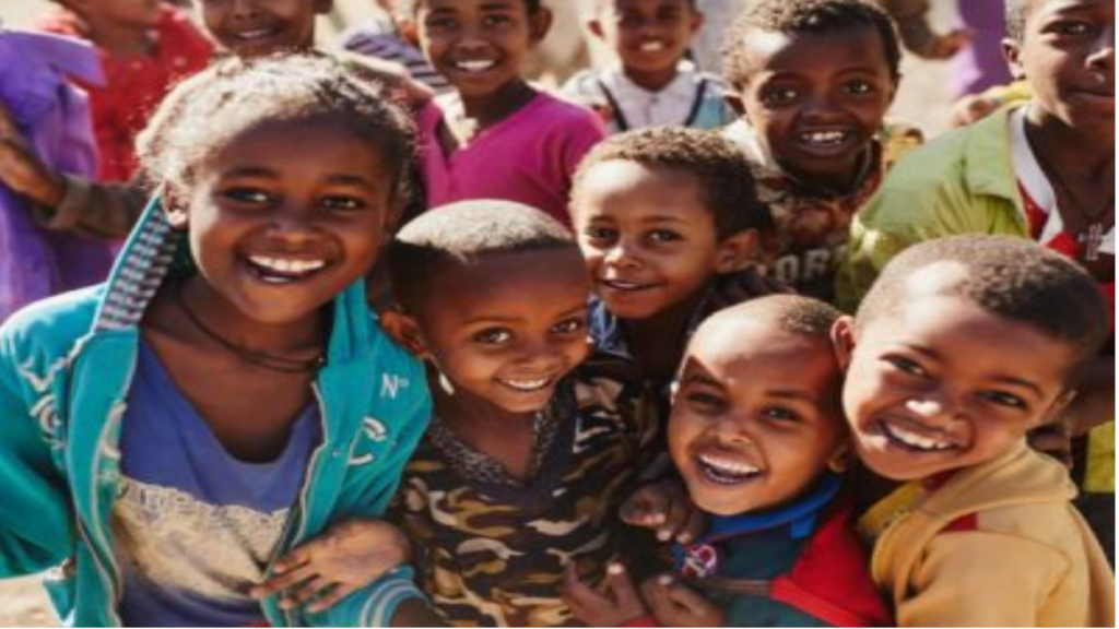 A group of children smiling for the camera.